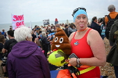 Surfers and swimmers take part in a mass ?Paddle Out? protest in Brighton