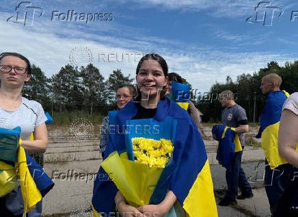 Ukrainian POWs are seen after a swap at an unknown location in Ukraine