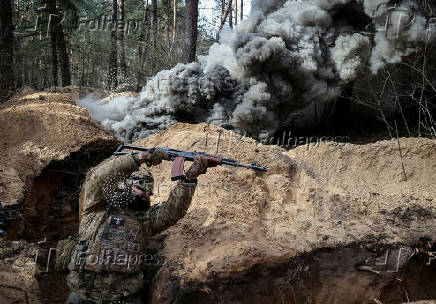 FILE PHOTO: A Ukrainian serviceman of the National Guard takes part in radiation, chemical and biological hazard drills near Kharkiv