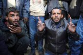 Palestinians mourn loved ones killed in Israeli strikes, in Khan Younis in the southern Gaza Strip