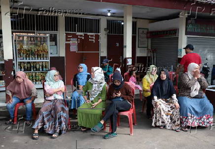 Voters cast their ballows in regional government elections in Indonesia