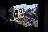 Site of an Israeli strike on a house, amid the Israel-Hamas conflict, in Al Maghazi refugee camp in the central Gaza Strip