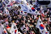 Impeached South Korean President Yoon Suk Yeol's supporters rally near the Corruption Investigation Office for High-ranking Officials, following his arrest, in Gwacheon