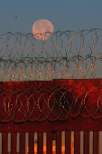 Razor wire fence to inhibit the crossing of migrants into the United States is seen from Ciudad Juarez