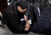 Palestinians mourn those killed in an Israeli strike, in Rafah, in the southern Gaza Strip