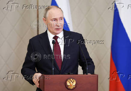 Russian President Putin attends a press conference in Astana