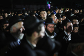 Mourners attend the funeral of Israeli rabbi, Zvi Kogan, in Kfar Habad