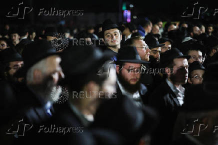 Mourners attend the funeral of Israeli rabbi, Zvi Kogan, in Kfar Habad