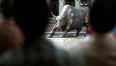 FILE PHOTO: FILE PHOTO: A bronze sculpture of a bull is seen on the premises of BSE building in Mumbai