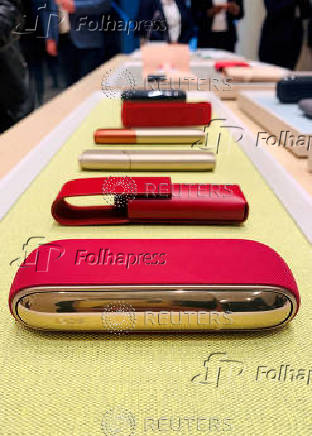 FILE PHOTO: FILE PHOTO: IQOS heated tobacco products are seen on display as cigarette maker Philip Morris International store in Sandton, South Africa
