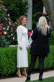 Geri Halliwell, pop icon and member of the Spice Girls, poses for a picture as she visits the Rose Garden at the White House, in Washington