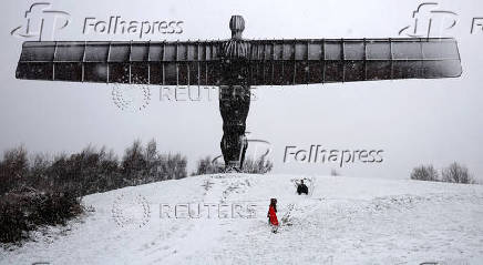 Snowfall at Antony Gormley's Angel of the North, in Gateshead