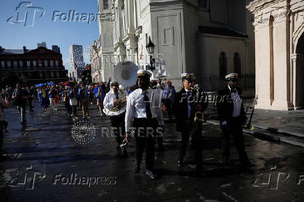 Members of the Perfect Gentlemen Social and Pleasure Club lead a second line parade in New Orleans