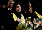 Mourners react during the funeral of Hezbollah commander Al-Hajj Mustafa Abdel Latif al-Zein, after a ceasefire agreement between Hezbollah and Israel took effect, in Beirut