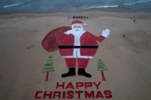 Santa Claus chocolate and sand installation on beach in Puri