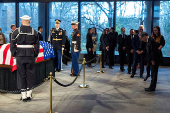 Consuls general and other mourners view the casket of former President Jimmy Carter as he lies in repose at the Carter Presidential Center in Atlanta