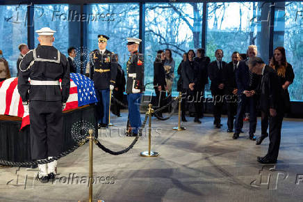 Consuls general and other mourners view the casket of former President Jimmy Carter as he lies in repose at the Carter Presidential Center in Atlanta