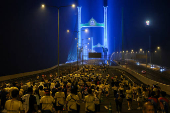 People attend a running event on the newly constructed cable-stayed Rama X Bridge or 