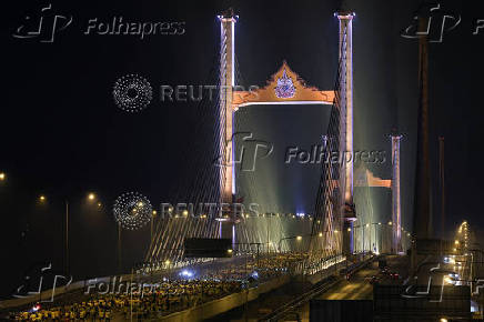 People attend a running event on the newly constructed cable-stayed Rama X Bridge or 