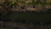Migrants shelter along Rio Grande river while searching for entry into the United States