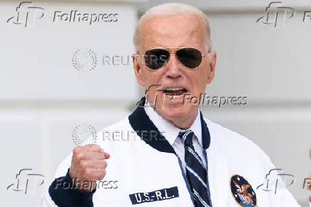 U.S. President Joe Biden wears the team USA Olympics jacket as he departs from the South Lawn of the White House