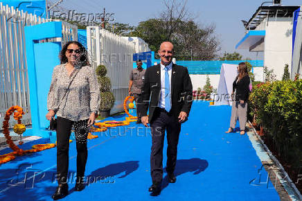 Reuven Azar, Israeli ambassador to India, walks along with his wife to join in the inauguration ceremony of HELA Systems in Hyderabad