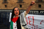 Demonstrators take part in a performance in support of Palestinians, in Mexico City