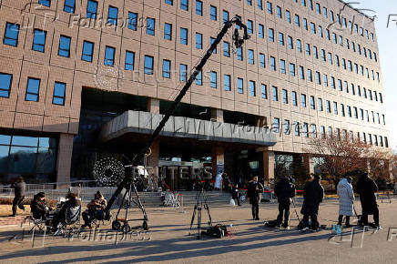 Members of the media wait the arrival of Impeached South Korean President Yoon Suk Yeol at the Corruption Investigation Office for High-ranking Officials in Gwacheon