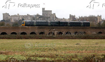 FILE PHOTO: A Great Western Railway train passes in front of Windsor Castle in Eton