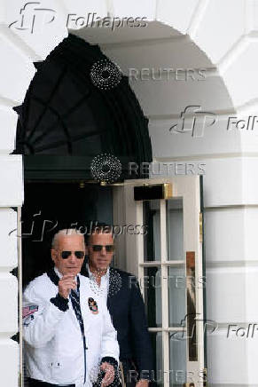 U.S. President Joe Biden wears the team USA Olympics jacket as he departs from the South Lawn of the White House