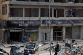 Men renovate their damaged shops, after the ceasefire between Israel and Hezbollah, in Beirut