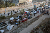 Displaced Palestinians wait to be allowed to return to their homes in northern Gaza, in the central Gaza Strip