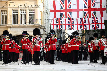 The Band of the Coldstream Guards march ahead of a banquet with Japan's Emperor Naruhito and Japan's Empress Masako, at The Guildhall in London