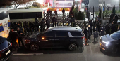 Vehicles believed to be of investigators from the Corruption Investigation Office for High-ranking Officials arrive at the impeached South Korean President Yoon Suk Yeol's official residence