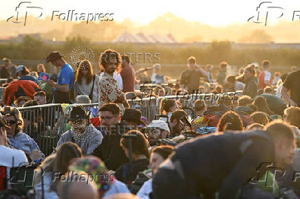 Revellers queue at Worthy Farm for the Glastonbury Festival in Pilton, Somerset
