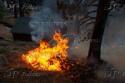 The Bridge Fire burns the mountain communities to the northeast of Los Angeles, in Wrightwood