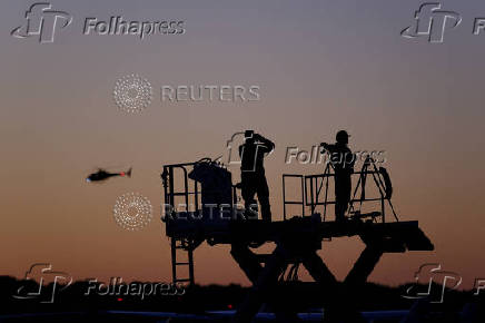 Members of security forces stand guard at Dane County Airport in Madison