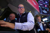 Traders work on the floor of the NYSE in New York