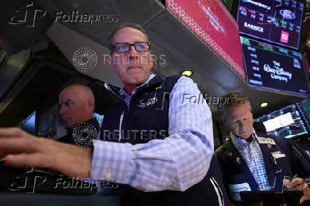 Traders work on the floor of the NYSE in New York