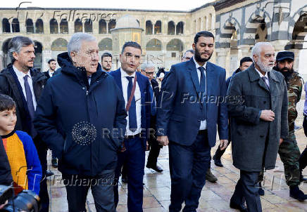 Italian Foreign Minister Antonio Tajani walks at the Umayyad Mosque, during a visit to the country following the ousting of Syria's Bashar al-Assad, in Damascus