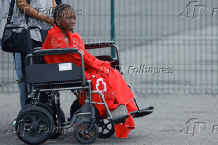 A migrant minor waits in a wheelchair to be assisted by the Red Cross at the port of Arguineguin