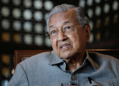 FILE PHOTO: Former Malaysian Prime Minister Mahathir Mohamad speaks during an interview in Putrajaya