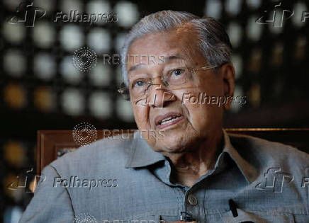 FILE PHOTO: Former Malaysian Prime Minister Mahathir Mohamad speaks during an interview in Putrajaya