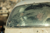 Children look from a vehicle, in Damascus