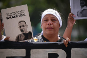 Relatives of detained Venezuelans protest, outside the public prosecutor's headquarters, in Caracas