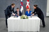 Denmark's Prime Minister Mette Frederiksen and the Faroese Prime Minister Aksel V. Johannesen sign a joint request to the Danish Supreme Court, in Prime Minister's Office, in Copenhagen