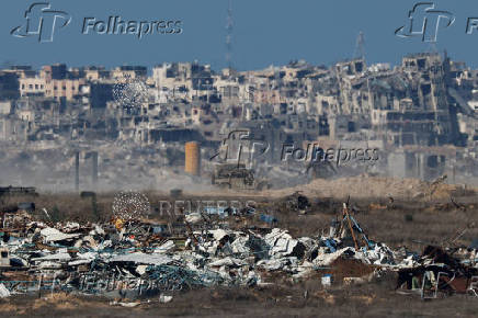 Israeli military vehicles manoeuvre inside the Gaza Strip, in southern Israel