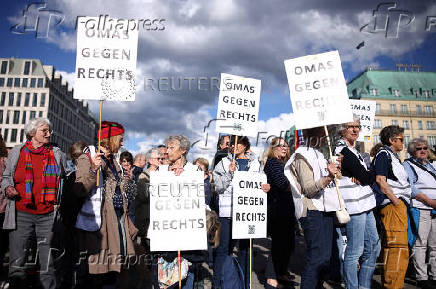 People attend a protest for democracy and against violence on Matthias Ecke, a member of the European Parliament, in Berlin