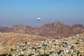 A balloon flies over Petra