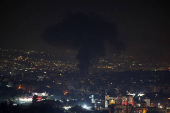 Smoke billows over Beirut's southern suburbs, as seen from Sin El Fil